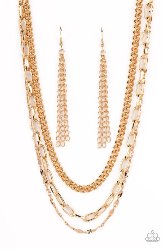 Paparazzi Accessories Galvanized Grit - Gold Three different kinds of weighted gold chains layer down the neck to create a gritty, edgy statement piece. Features an adjustable clasp closure. Sold as one individual necklace. Includes one pair of matching e