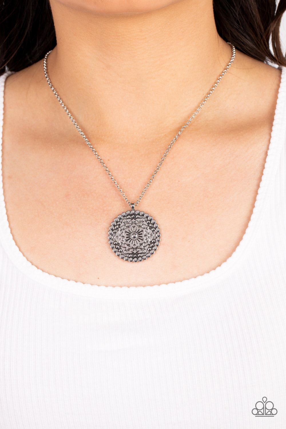 Paparazzi Accessories Summer HOMESTEAD - Silver A circular silver disc is embellished with an intricate floral mandala motif. Tactile silver dots encircle the blooming flowers with an additional silver stud adorning the top of the design. Each petal is et