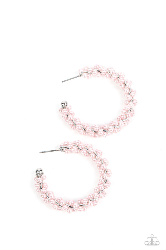 Paparazzi Accessories Yacht Royale - Pink A dainty strand of baby pink pearls is delicately wrapped around a classic silver hoop, creating bubbly refinement. Earring attaches to a standard post fitting. Hoop measures approximately 1 1/2" in diameter. Sold