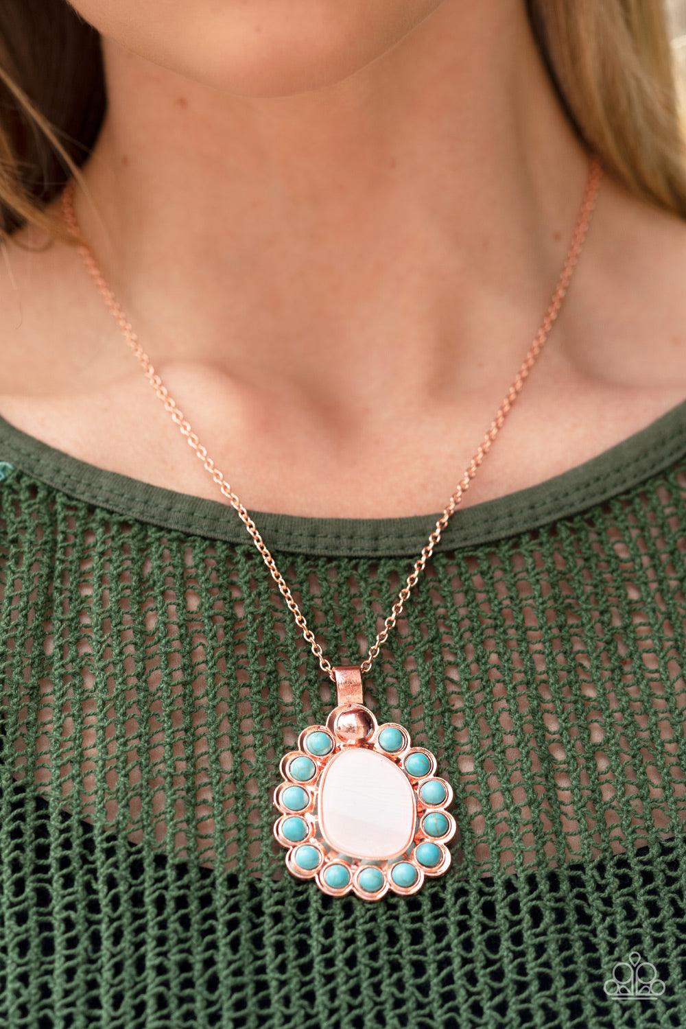 Paparazzi Accessories Sahara Sea - Copper Dangling from a shiny copper chain, an asymmetrical white shell with an opal finish is encircled by a turquoise stone-studded frame, creating a seasonal Southwestern pattern. As the stone elements in this piece ar