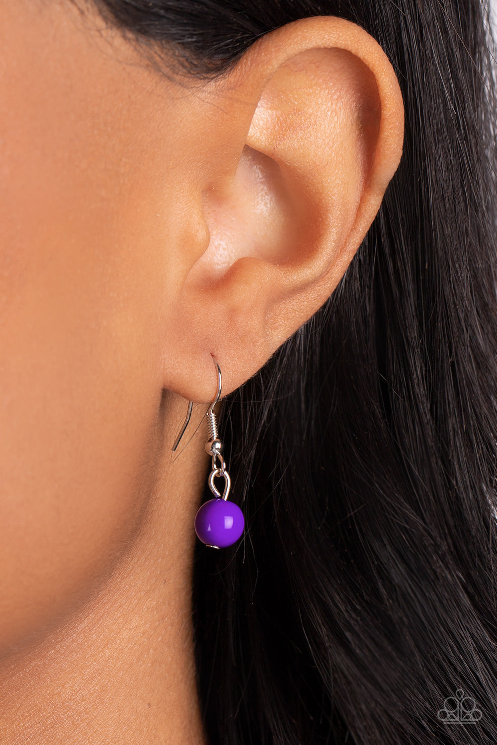 Paparazzi Accessories Polished Parade - Purple Rounded rectangular beads in a vibrant purple hue are pressed into silver frames, showcasing their faceted surfaces as they crawl along the collar. Small rectangular plates, hammered in subtle texture, shimme