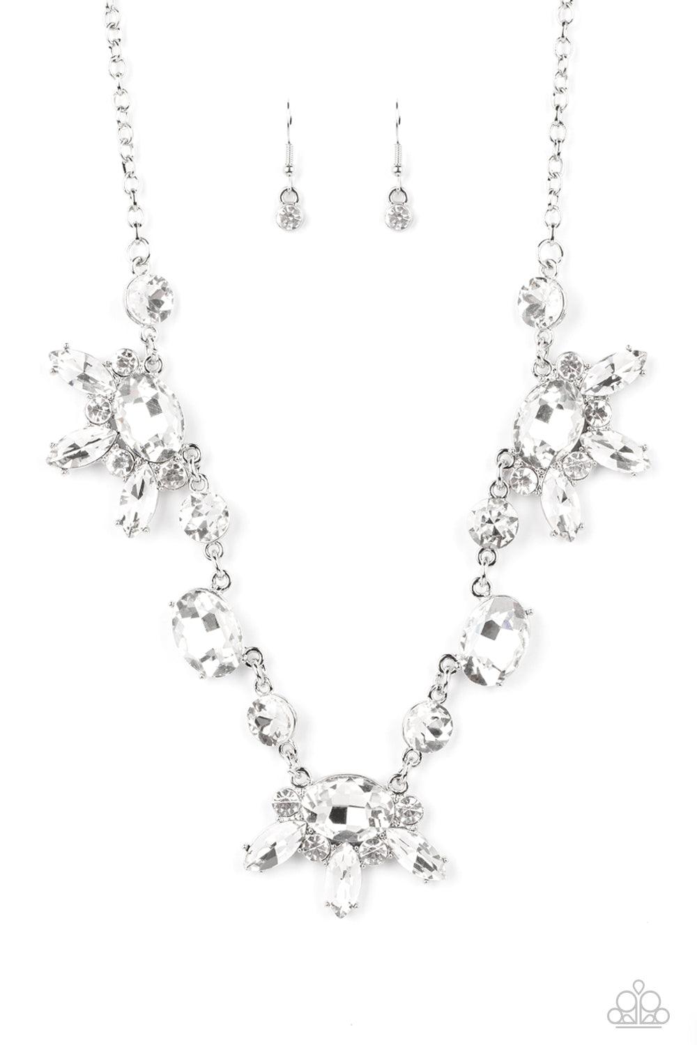 Paparazzi Accessories GLOW-trotting Twinkle - White Brilliant white rhinestones in round, oval, and marquise cuts, create an abstract pattern as they fall along the neckline. The faceted surfaces of each gem catch and reflect light from every angle, resul
