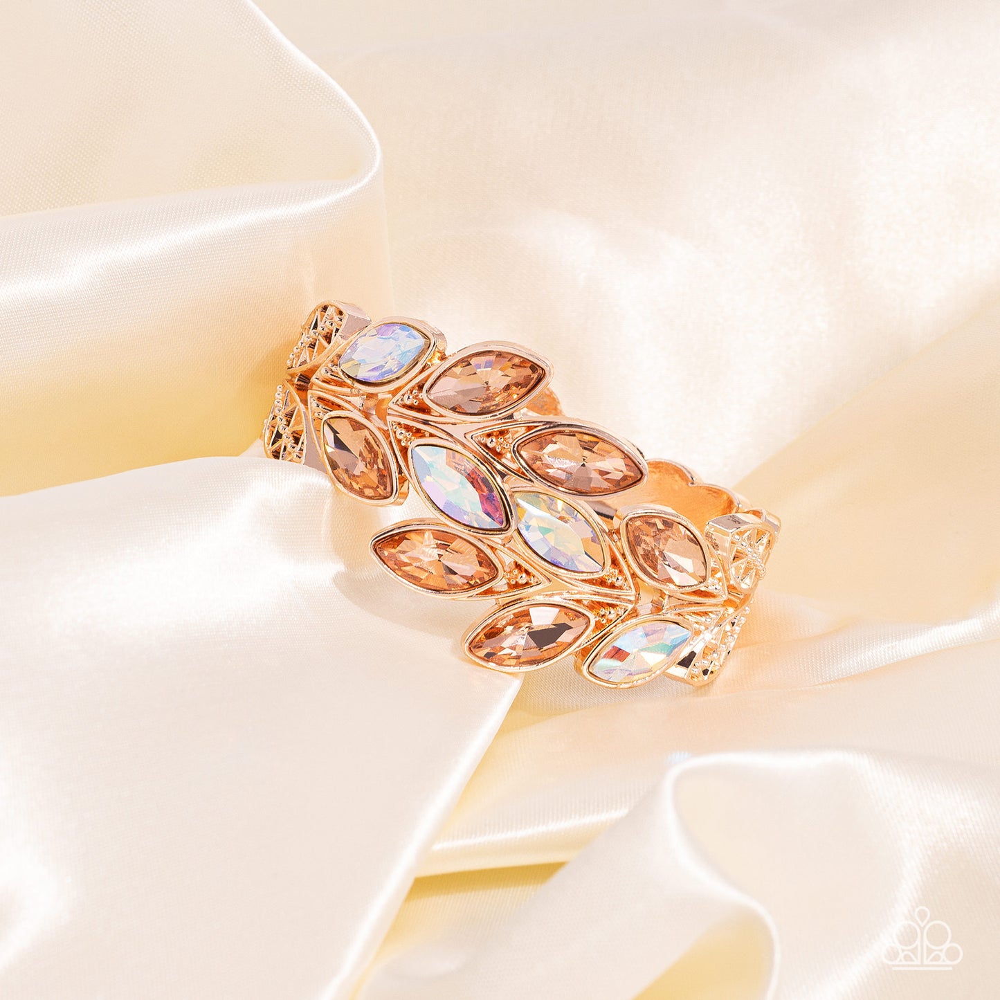 Paparazzi Accessories Luminous Laurels - Rose Gold Rose gold and peachy iridescent marquise-cut gems blossom from an array of rose gold marquise frames embossed in leafy filigree and tactile studs. Each frame interlocks around the wrist in a whimsical pat