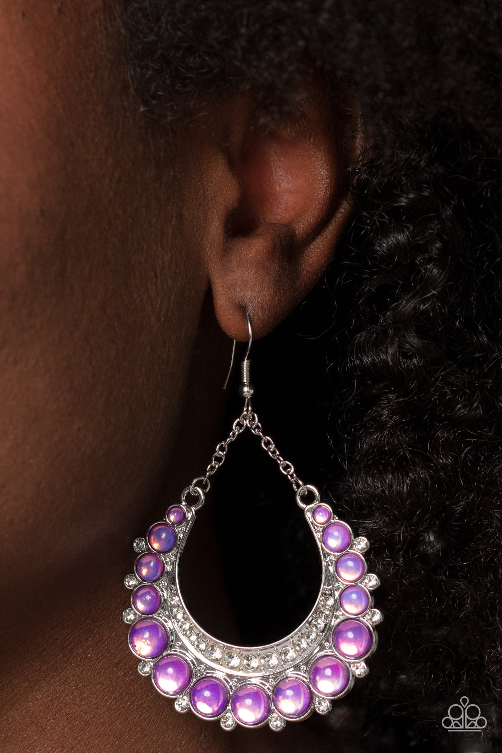 Paparazzi Accessories Bubbly Bling - Purple Bubbly purple beads are wrapped in silver frames as they fan out into a dramatic horseshoe shape. A thick silver crescent lined with white rhinestones nestles along the inside of the curve at the bottom, as tiny