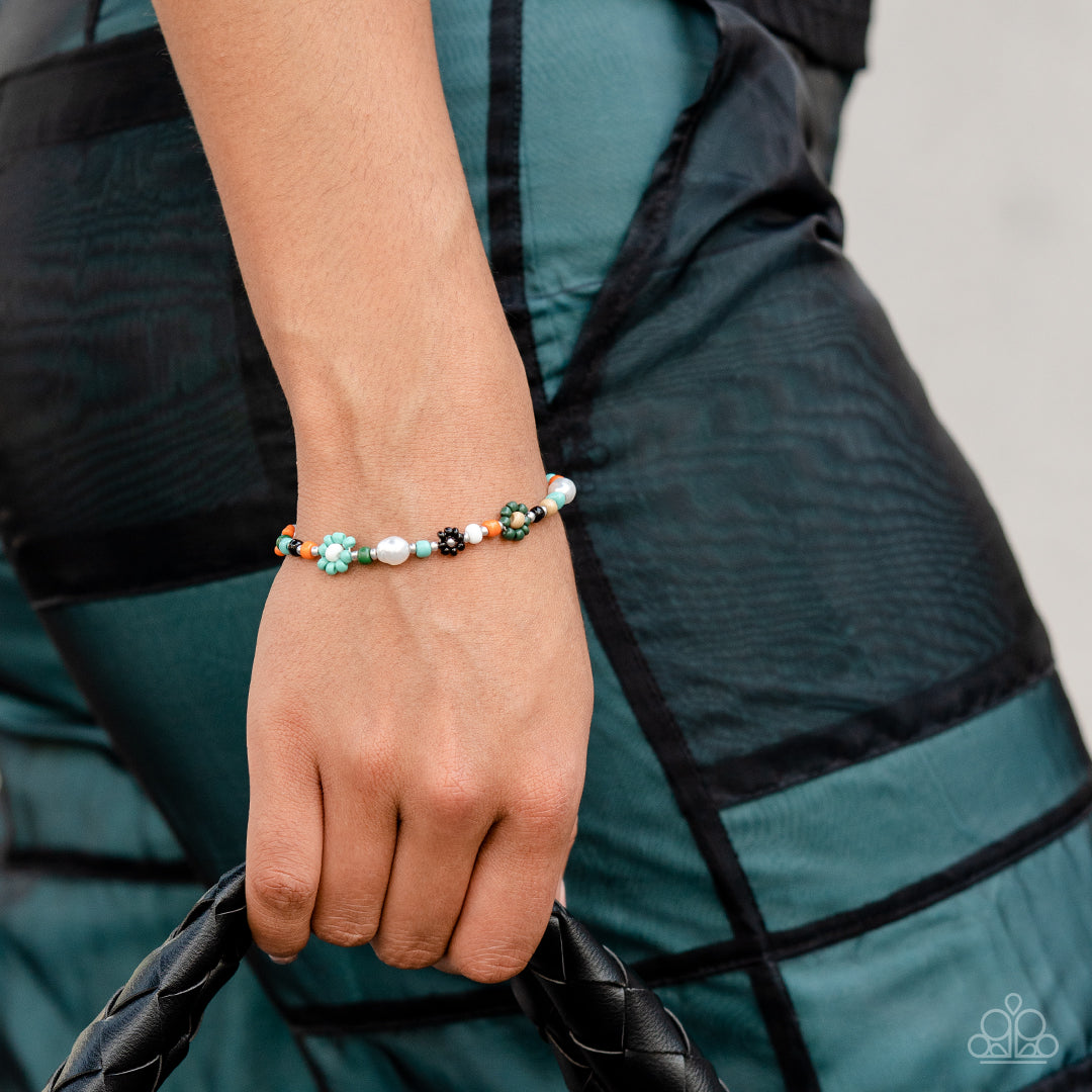 Paparazzi Accessories Groovy Gerberas - Blue Modeled after gerber daisies, multicolored seed beed petals in shades of Tiffany, orange, olive green, and black bloom around white, Iced Coffee, and silver beaded centers resulting in a dazzling collection of