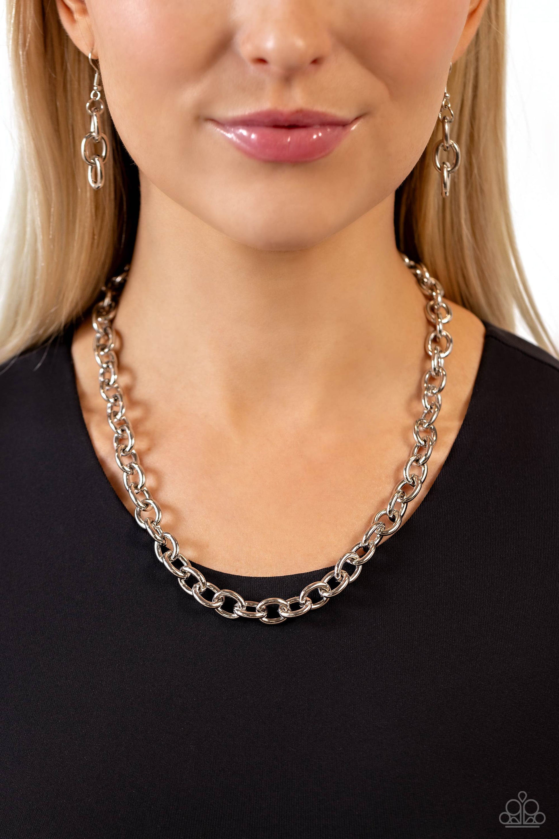 Paparazzi Accessories Things Have CHAIN-ged - Silver A strand of thick oversized silver chain links creates a bold, yet minimalistic statement piece as it wraps around the neck in an industrial-inspired finish. Features an adjustable clasp closure. Sold a