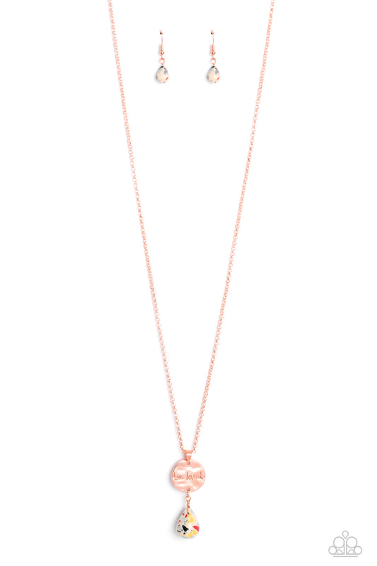 Paparazzi Accessories Caring Couture - Multi Swinging from a dainty shiny copper chain, a hammered disc in the same hue is stamped with the words "be kind." A chiseled stone teardrop painted with multicolored flecks hangs from the bottom of the pendant ad