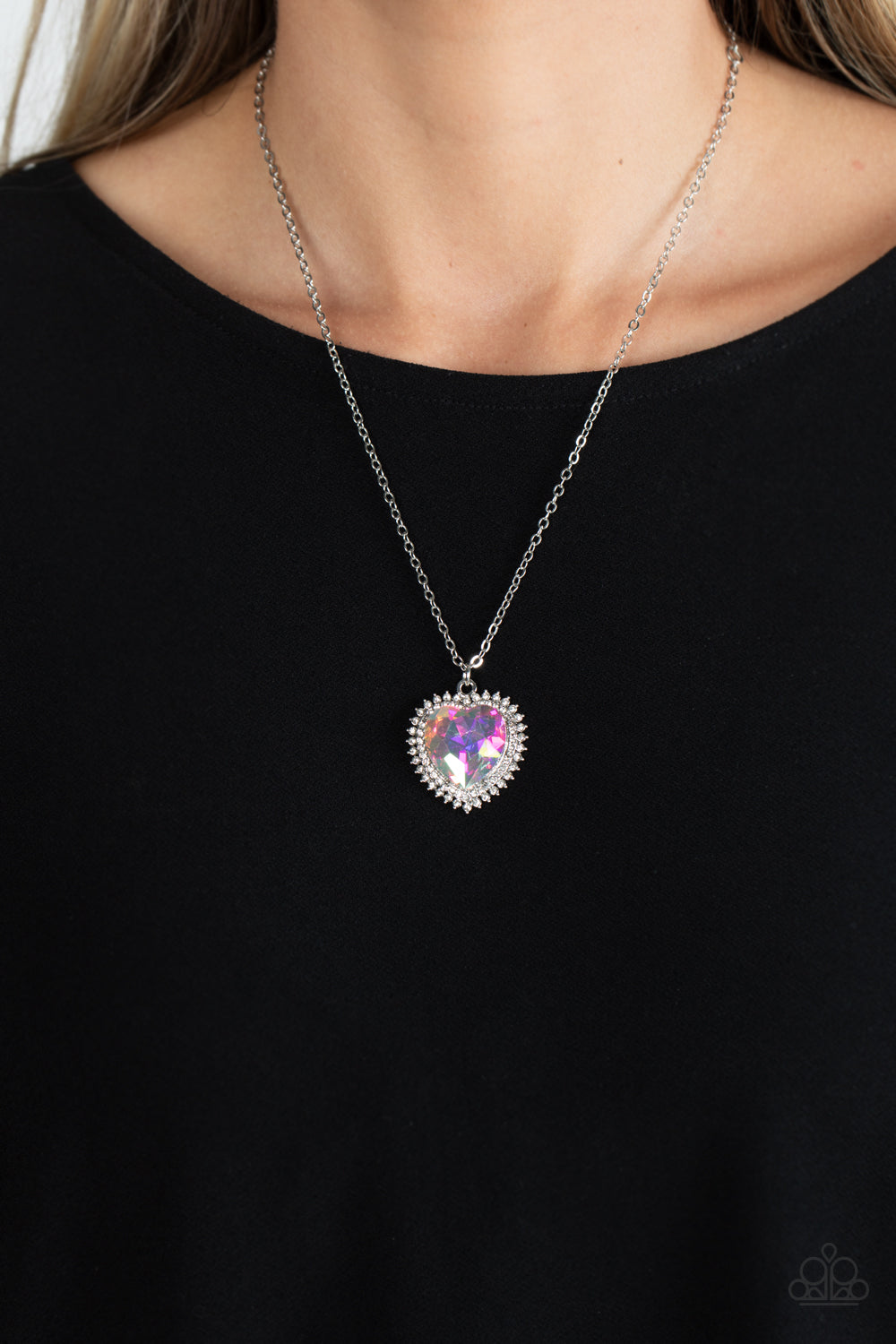 Paparazzi Accessories Sweethearts Stroll - Multi An iridescent, crystal-like heart gem sparkles dramatically as it's wrapped in a glassy white rhinestone-studded heart frame. Adding additional shimmer, a second layer of white rhinestones encircles the stu
