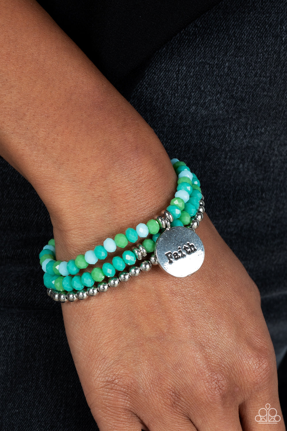 Paparazzi Accessories Fashionable Faith - Green Embellished with silver and defaced beads in varying shades of green, three bracelets are threaded along elastic stretchy bands, for a fashionable stack across the wrist. Falling from one of the varying gree