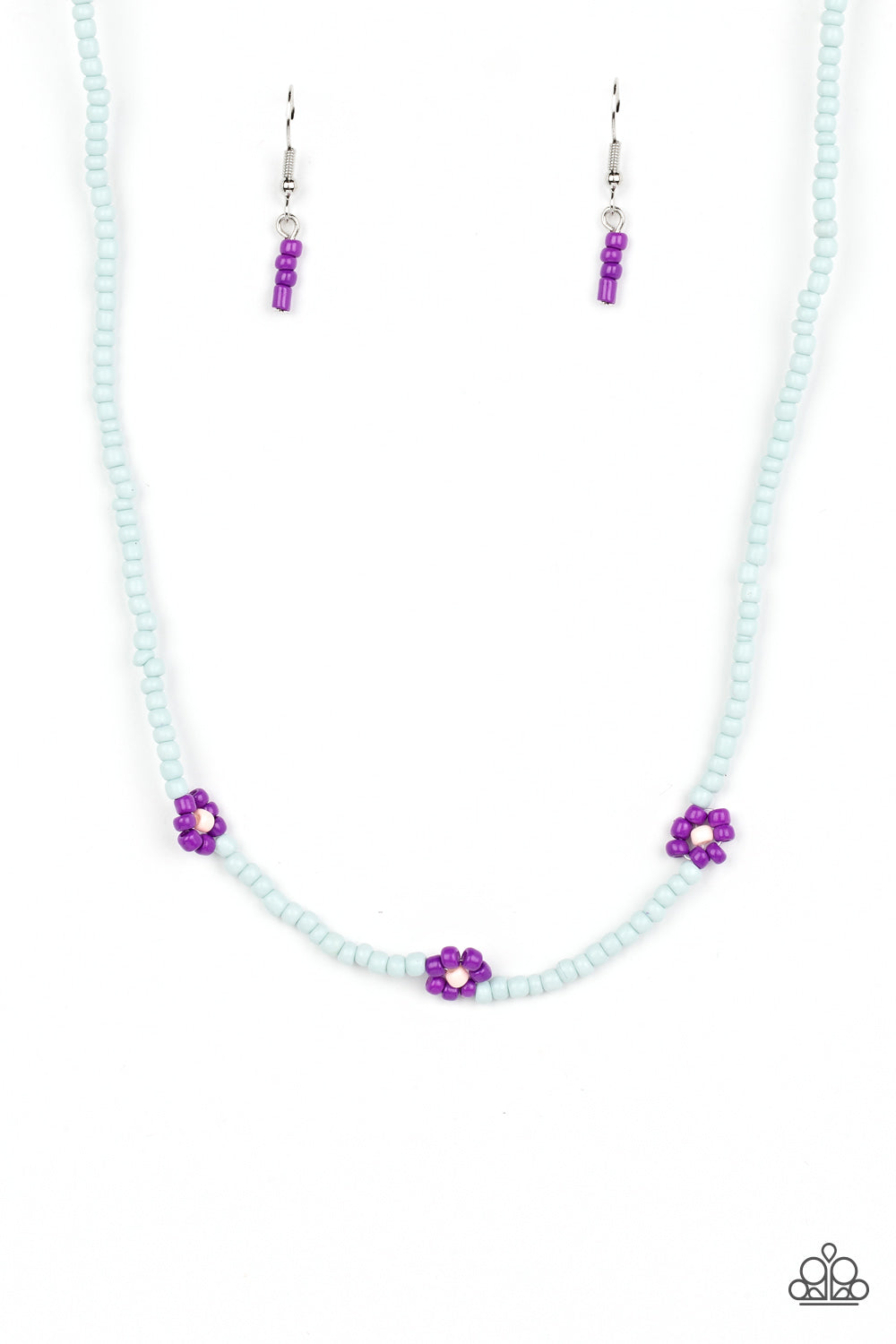 Paparazzi Accessories Bewitching Beading - Purple Strung along the entirety of an invisible wire, light blue seed beads coalesce around the collar. The row of blue seed beads are haphazardly interrupted by blooming purple seed bead flowers, with baby pink