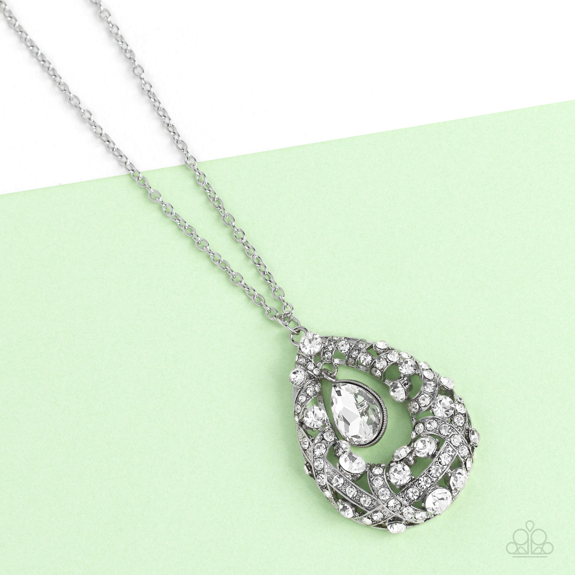 Paparazzi Accessories Glitz and GLOW - White A small teardrop, crystal-like white gem is pressed into a sleek, silver frame as it's suspended from a larger gem and rhinestone-dusted airy teardrop frame. The various sizes of crystal-like gems and white rhi