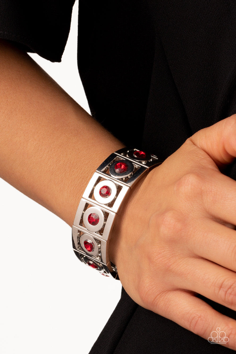 Paparazzi Accessories Stretch of Drama - Red Vibrant red rhinestones are encased in thick, circular silver borders and nestled inside rectangular frames with the same metallic sheen. The frames are threaded along stretchy elastic bands, wrapping around th