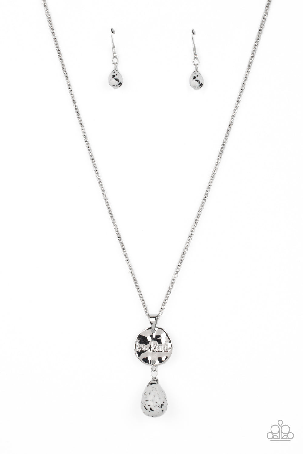 Paparazzi Accessories Caring Couture - White Swinging from a dainty silver chain, a hammered disc in the same hue is stamped with the words "be kind." A chiseled white speckled teardrop hangs from the bottom of the pendant adding a fashionably rustic feat