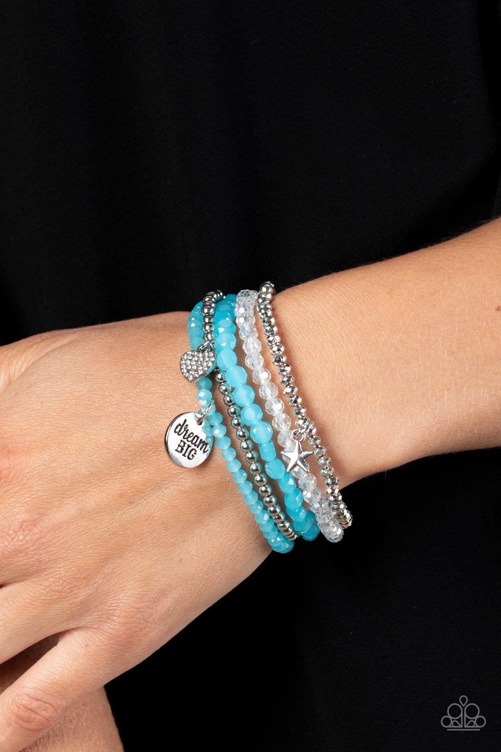 Paparazzi Accessories Teenage DREAMER - Blue Reflective blue, defaced silver, reflective white, and smooth silver beads wrap around stretchy bands, and combine into a colorful stack along the wrist. The reflective, blue-beaded bracelet features a silver p
