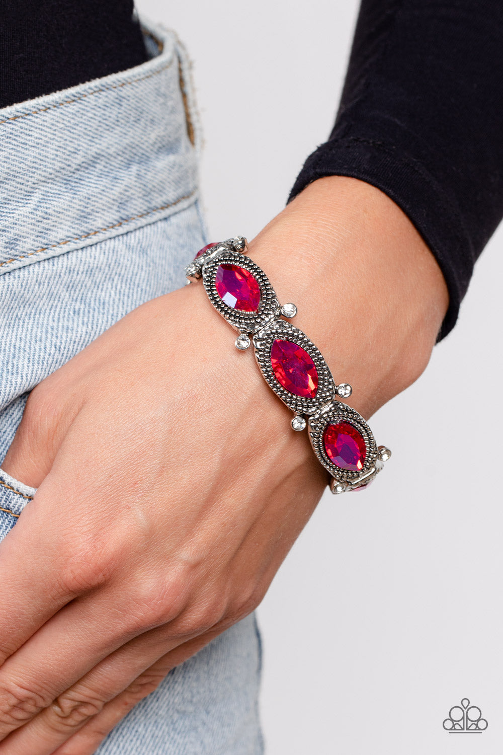 Paparazzi Accessories Dancing Diva - Pink Glittery pink gems are pressed into silver studded, marquise-cut frames, titled on its side. Separated by dainty white rhinestones encased in sleek silver frames, the sparkly collection is threaded along elastic s