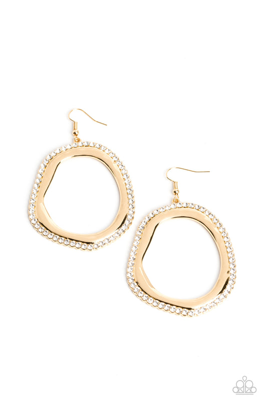 Paparazzi Accessories Scintillating Shareholder - Gold An oversized, oblong, gold hoop rippling with subtle hammered textures swings below the ear. A blinding row of white rhinestones encrusts along the outer edge of the hoop for a light-emitting glow. Ea
