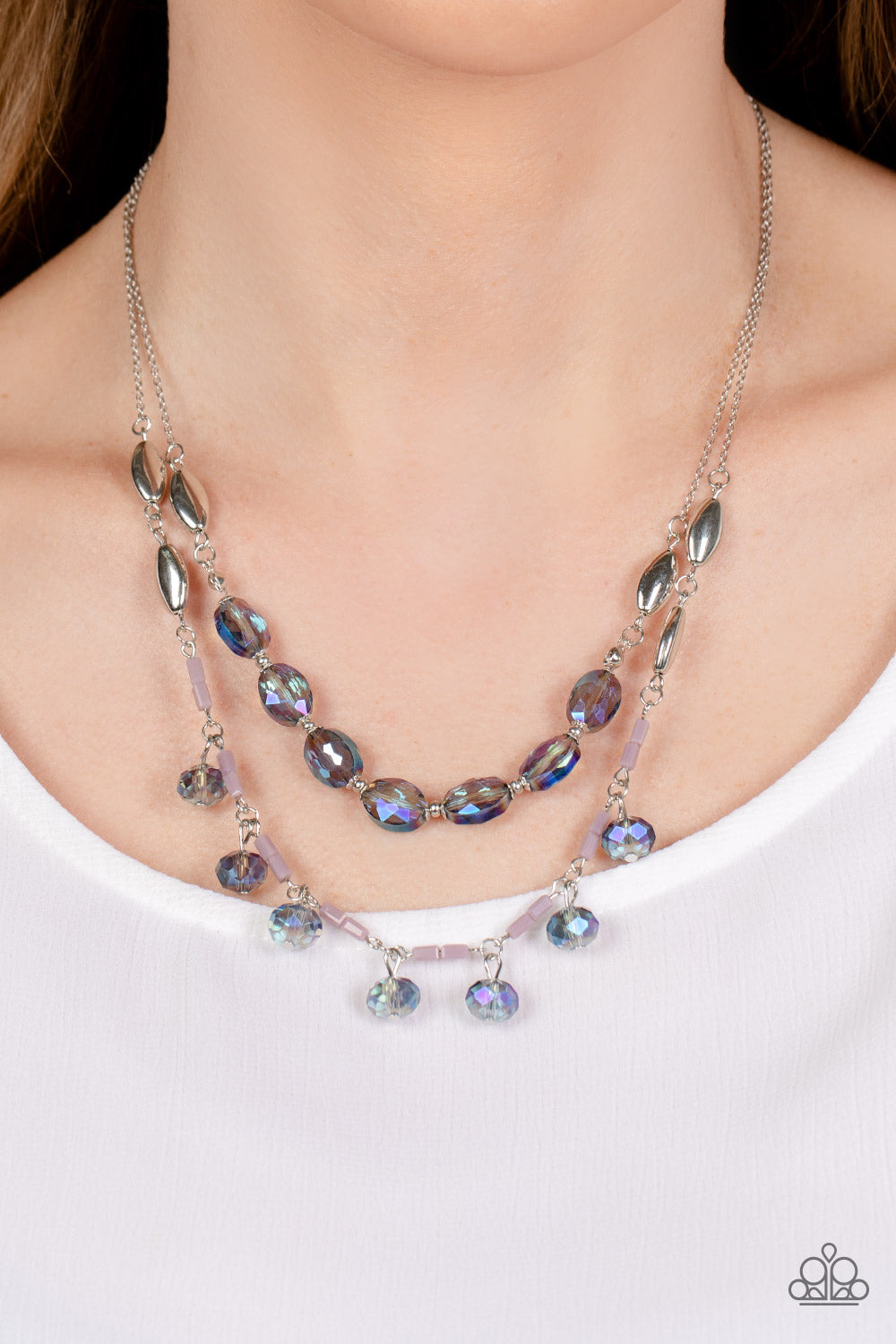 Paparazzi Accessories Sheen Season - Blue Two strands of dainty silver chain are adorned in a collection of mauve opaque beads, faceted glassy blue beads, and silver accents, culminating in a layered design rich with vintage character. The glassy beads th
