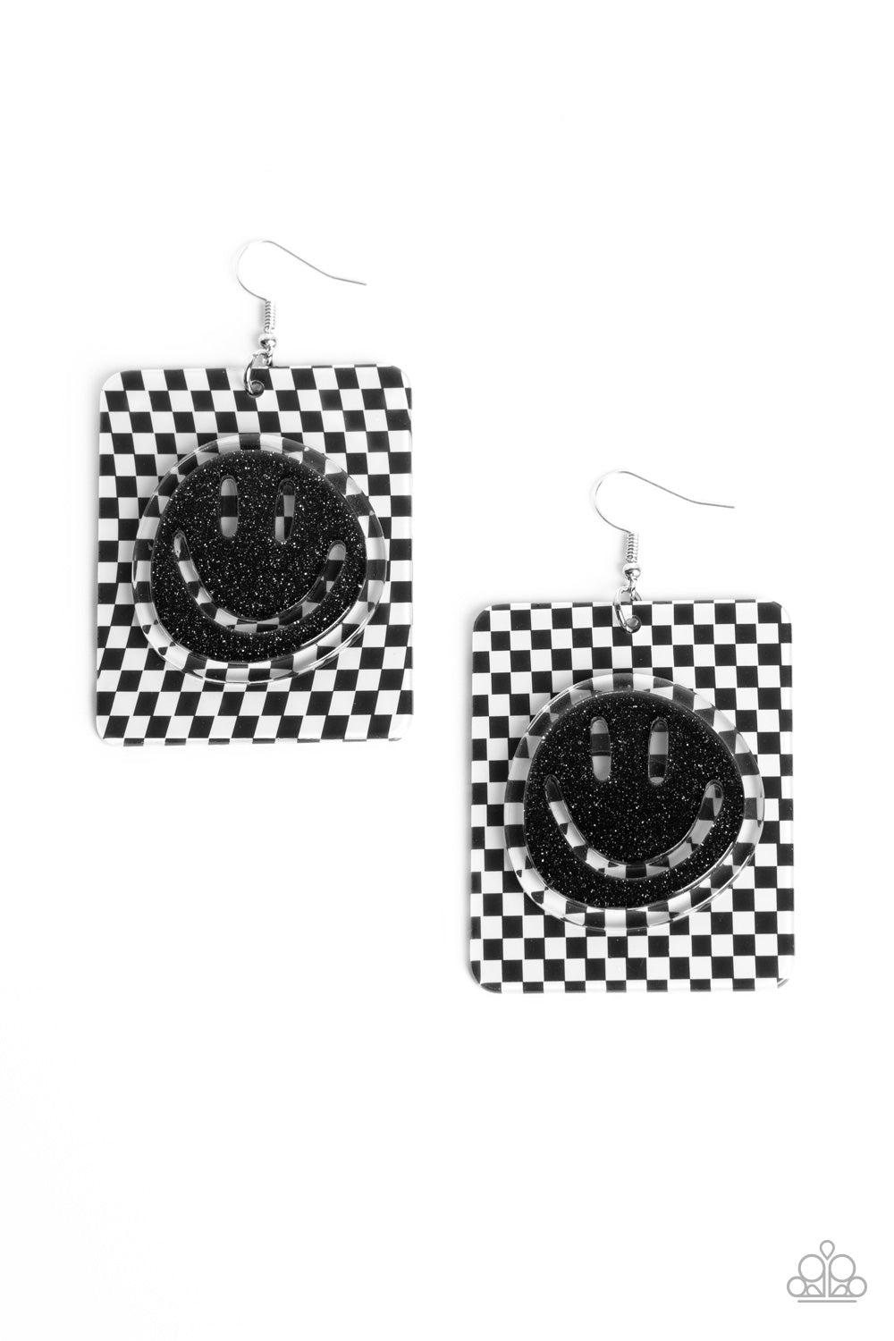 Paparazzi Accessories Cheeky Checkerboard - Black Set against a trendy, checkerboard backdrop, an oversized, sparkly, black smiley face stands out for a cheerfully captivating statement piece near the ear. Earring attaches to a standard fishhook fitting.