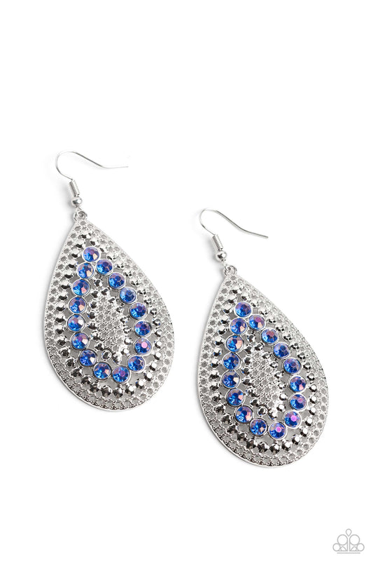 Paparazzi Accessories Spirited Socialite - Blue Set against an airy, dot motif backdrop, faceted blue rhinestones curve into a teardrop shape atop an oversized silver teardrop lure, creating a dazzling pop of color near the ear. Earring attaches to a stan