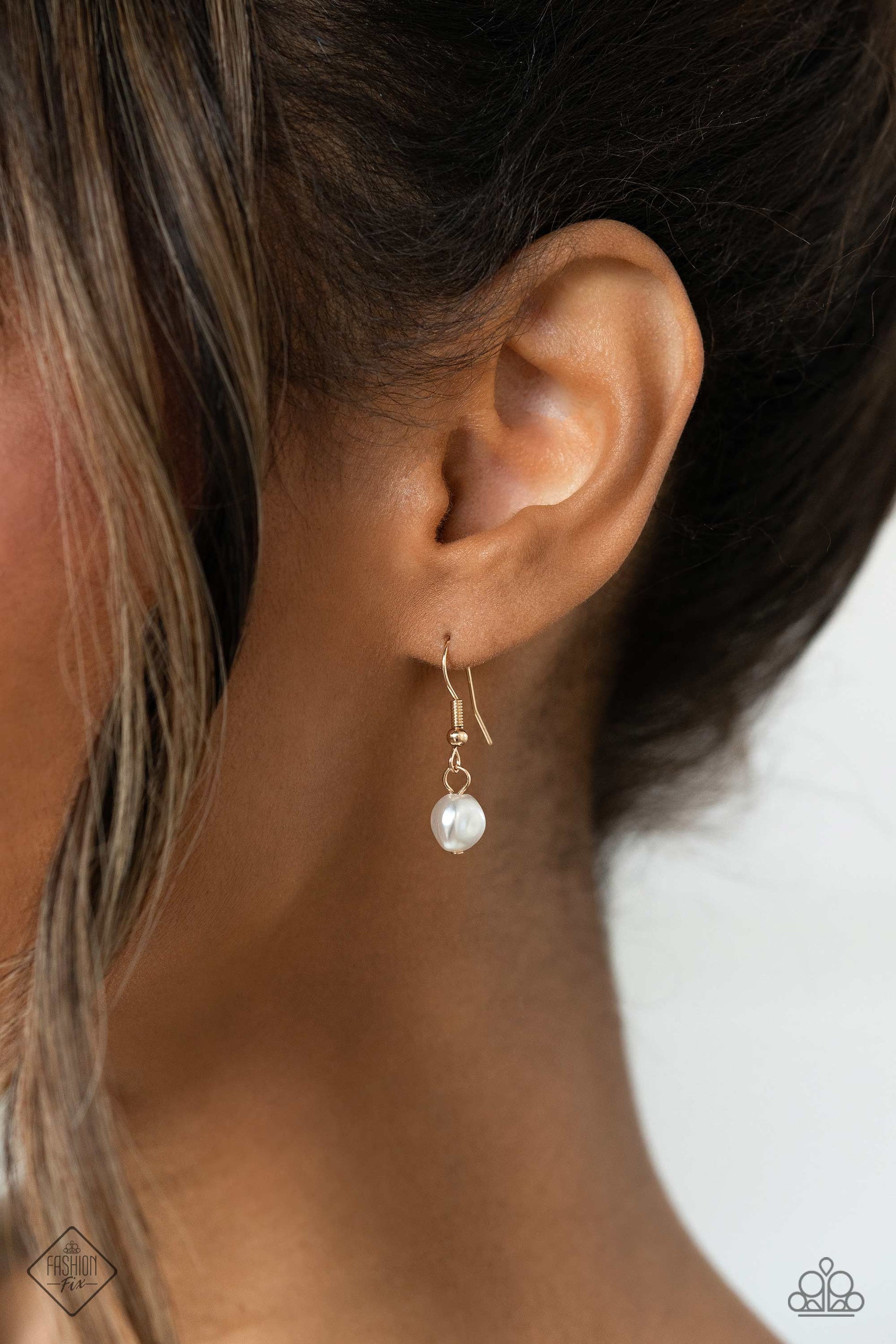 Paparazzi Accessories Audaciously Austen - Gold Three shimmery gold chains layer across the chest, with each strand featuring a different motif. Featured on the uppermost chain, white baroque pearls sporadically dot a dainty gold chain. Below it, a gold p