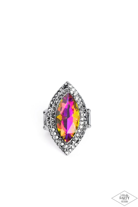 Paparazzi Accessories Jaw-Dropping Dazzle - Multi 2 Featuring a UV shimmer, a dramatic gem is pressed into the center of stacking gunmetal frames encrusted in row after row of hematite rhinestones for a blinding look. Features a stretchy band for a flexib