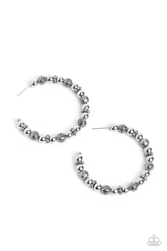 Paparazzi Accessories Rebuilt Ruins - Silver A collection of antiqued and decorative silver beads, silver wheel beads, and high-sheen silver beads are threaded along a thin curve around the ear for a trendy monochromatic look. Earring attaches to a standa