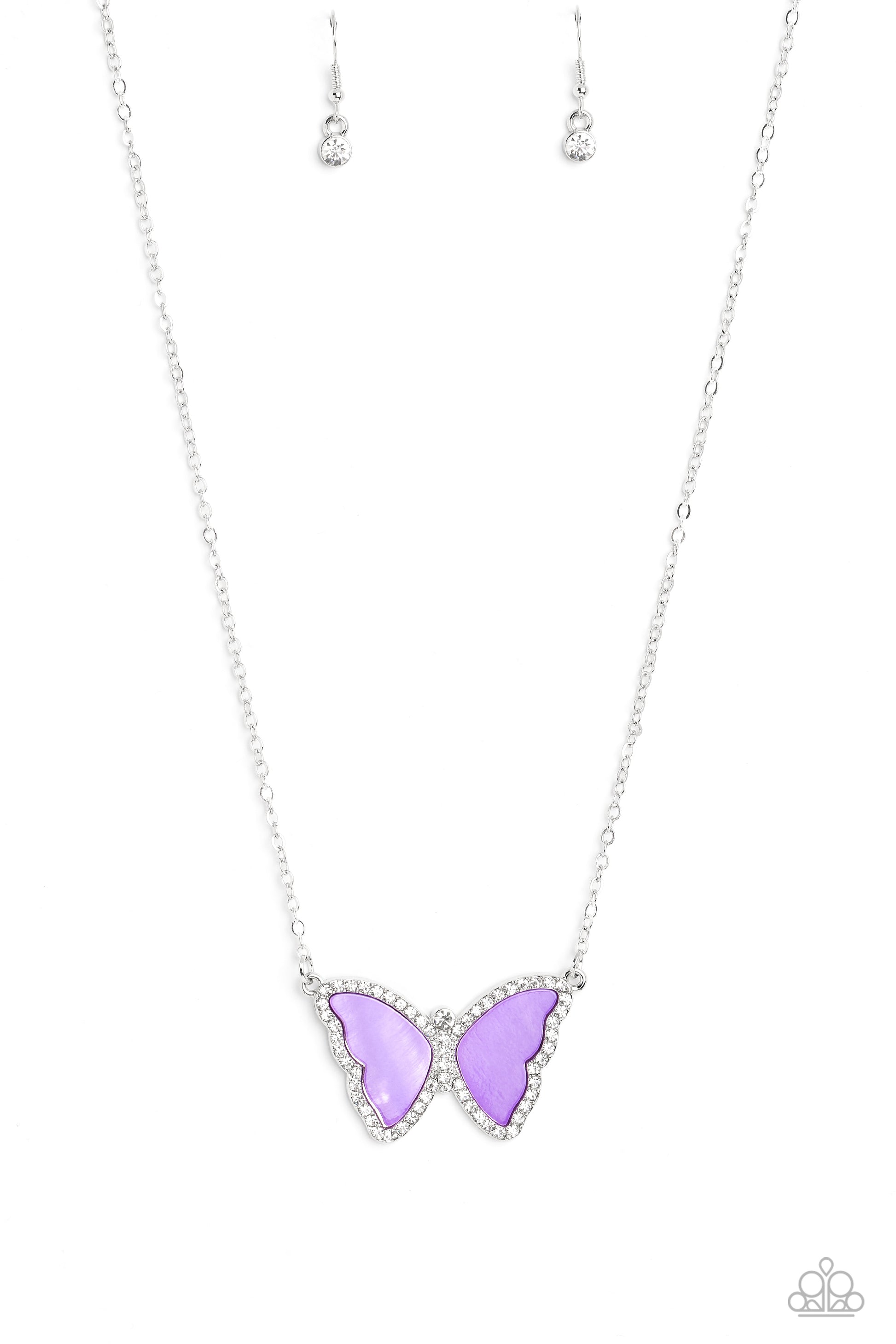 Paparazzi Accessories SHELL-bound - Purple Shimmery lavender shells are encased inside a silver butterfly frame, creating its wings. Bordering the shell wings and encrusted along the butterfly's body, are white rhinestones that shimmer and shine at the bo