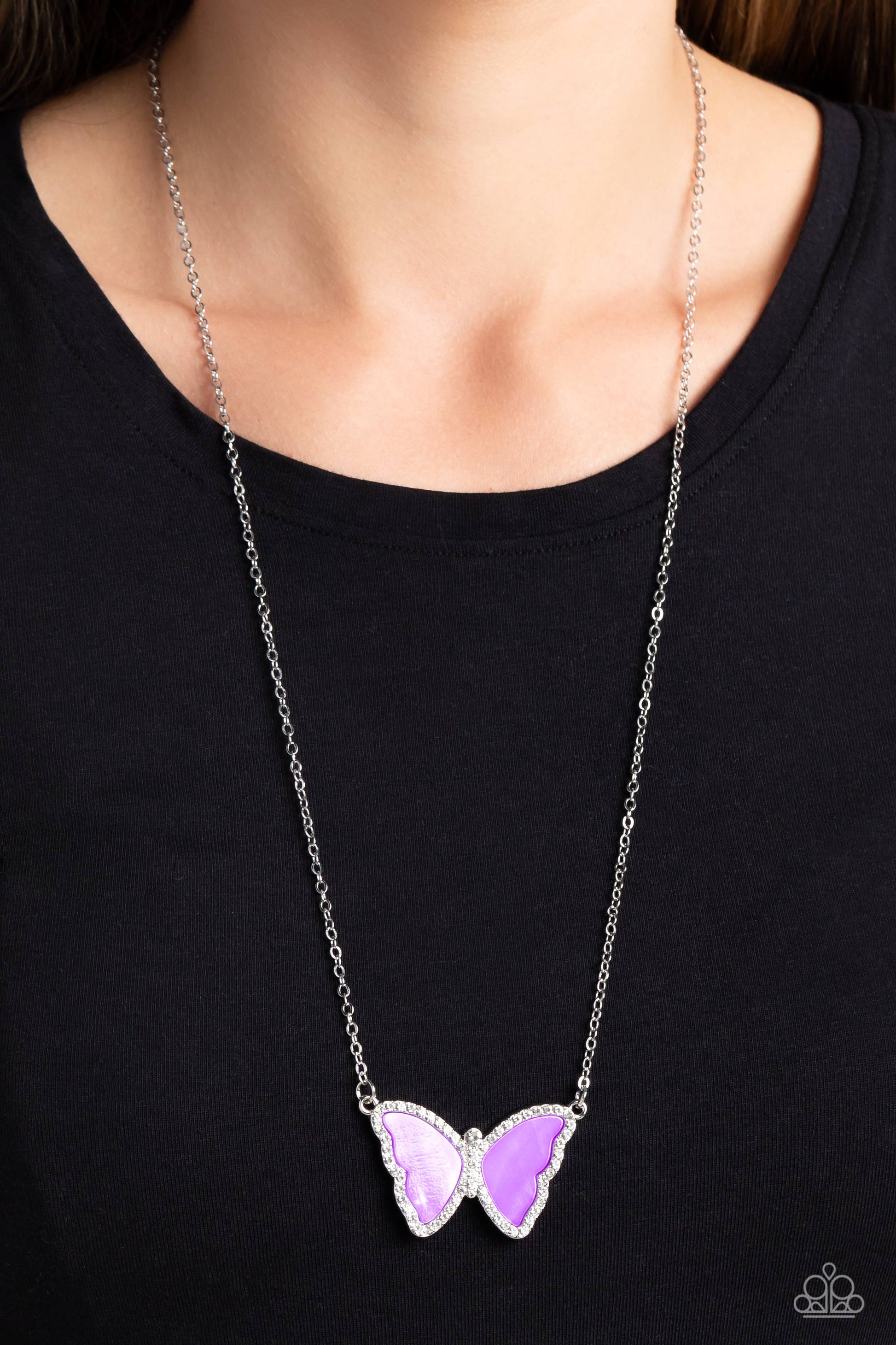 Paparazzi Accessories SHELL-bound - Purple Shimmery lavender shells are encased inside a silver butterfly frame, creating its wings. Bordering the shell wings and encrusted along the butterfly's body, are white rhinestones that shimmer and shine at the bo