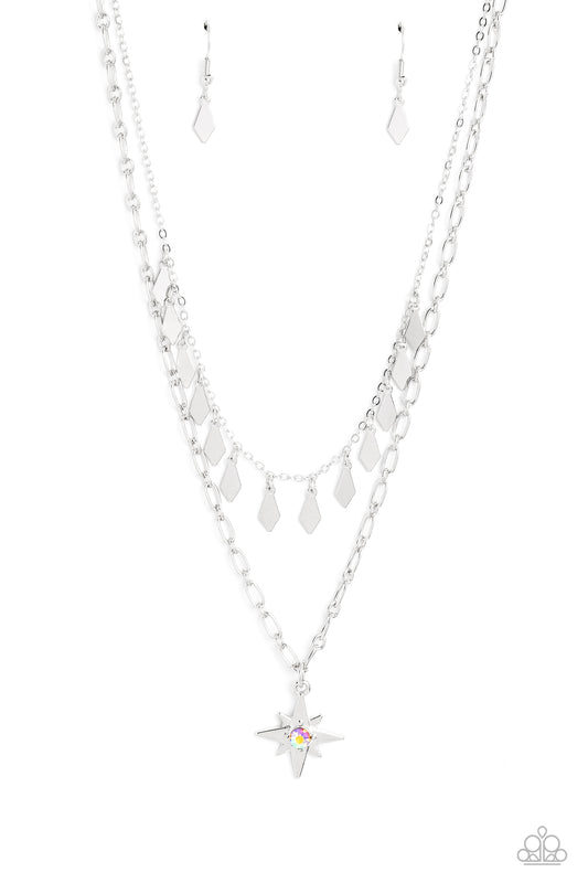 Paparazzi Accessories The Second Star To The LIGHT - Orange A three-dimensional silver star, dotted with a single orange-iridescent rhinestone glides on a paperclip chain down the neckline for an out of-this-world vibe. Flat and flared silver frames dance