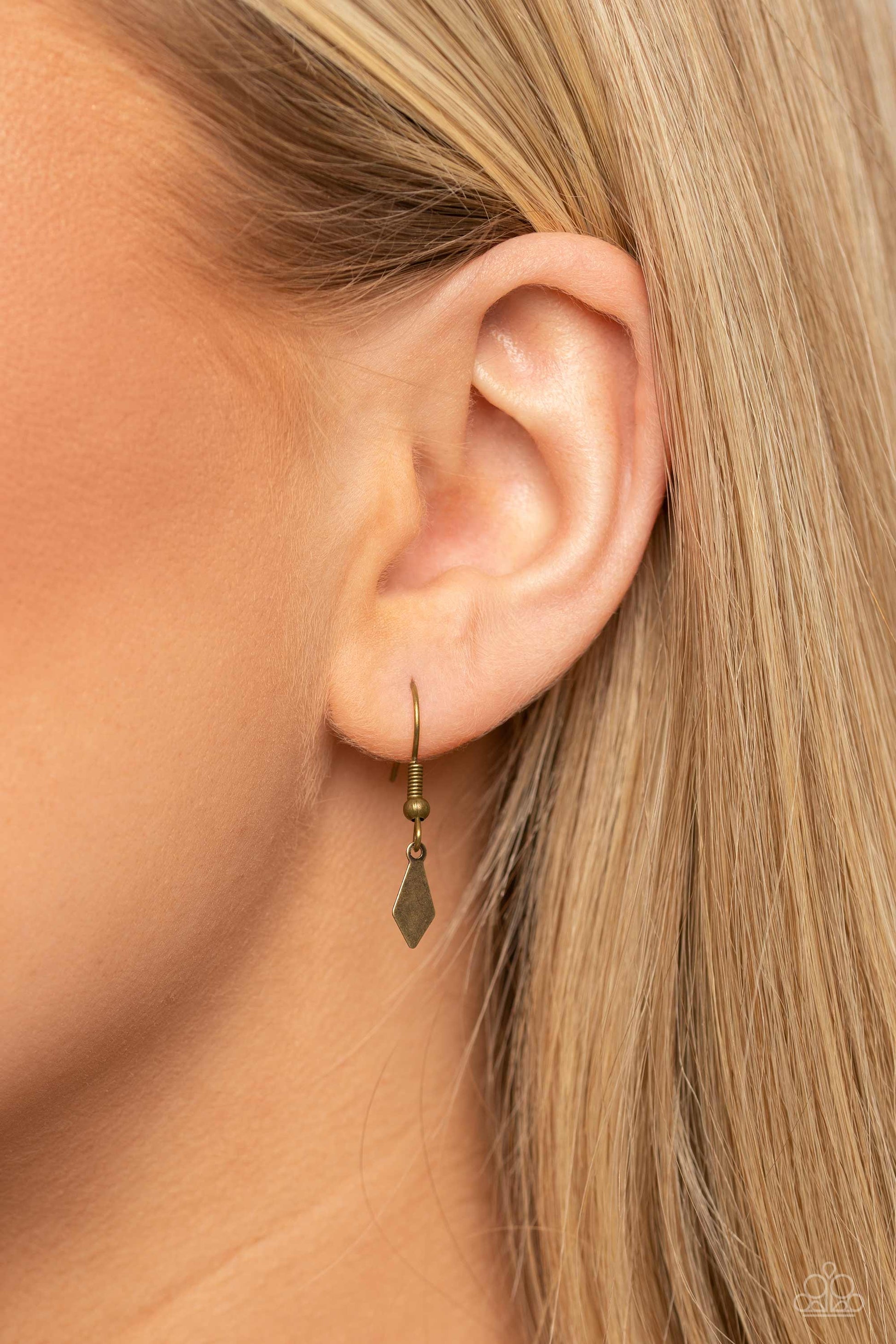Paparazzi Accessories The Second Star To The LIGHT - Brass A three-dimensional brass star, dotted with a single iridescent rhinestone glides on a paperclip chain down the neckline for an out of-this-world-vibe. Flat and flared brass frames dance above the