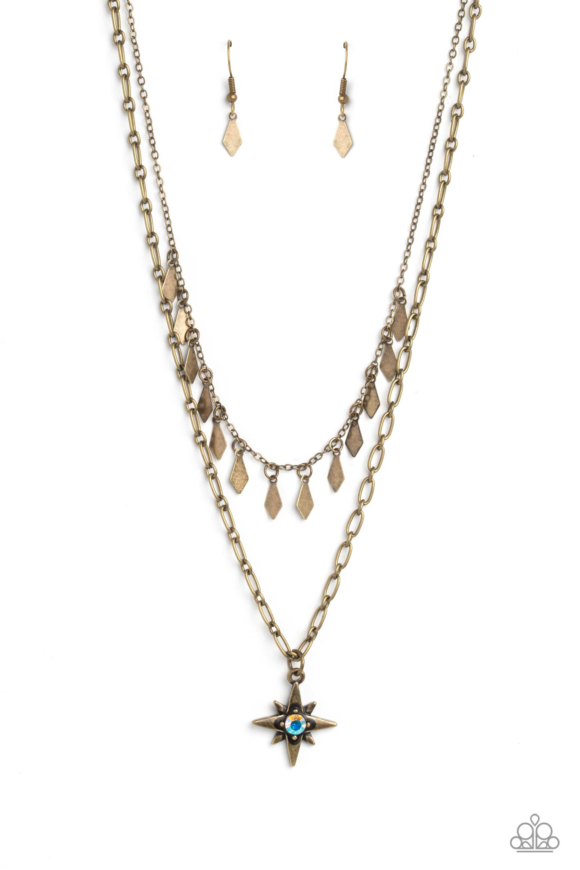 Paparazzi Accessories The Second Star To The LIGHT - Brass A three-dimensional brass star, dotted with a single iridescent rhinestone glides on a paperclip chain down the neckline for an out of-this-world-vibe. Flat and flared brass frames dance above the