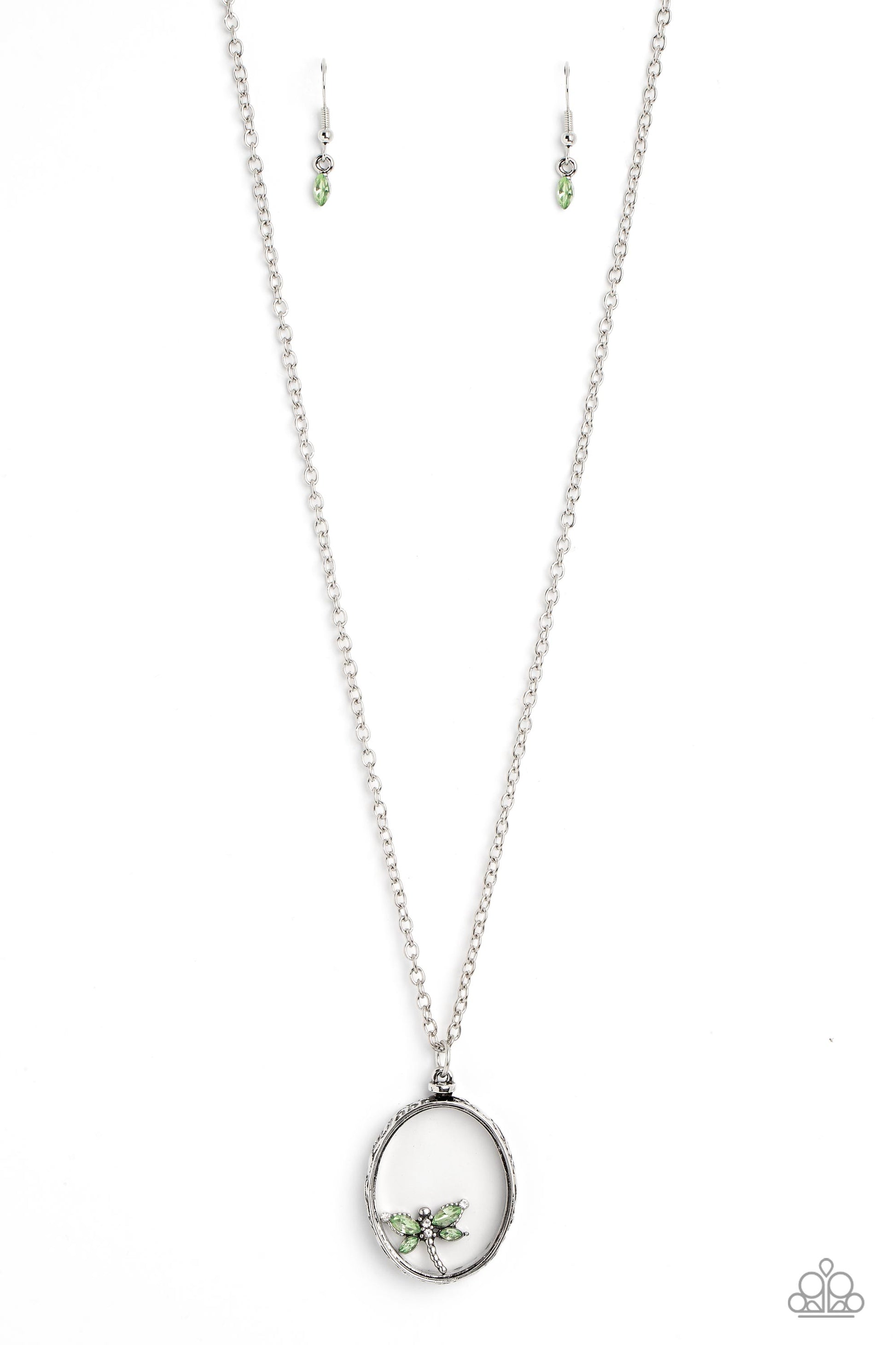 Paparazzi Accessories Dynamic Dragonfly - Green Falling from a high-sheen silver chain, a thick oval pendant with a faceted clear center lengthens the torso as it swings from the bottom of the chain. Swinging from the center of the shimmery pendant, an in