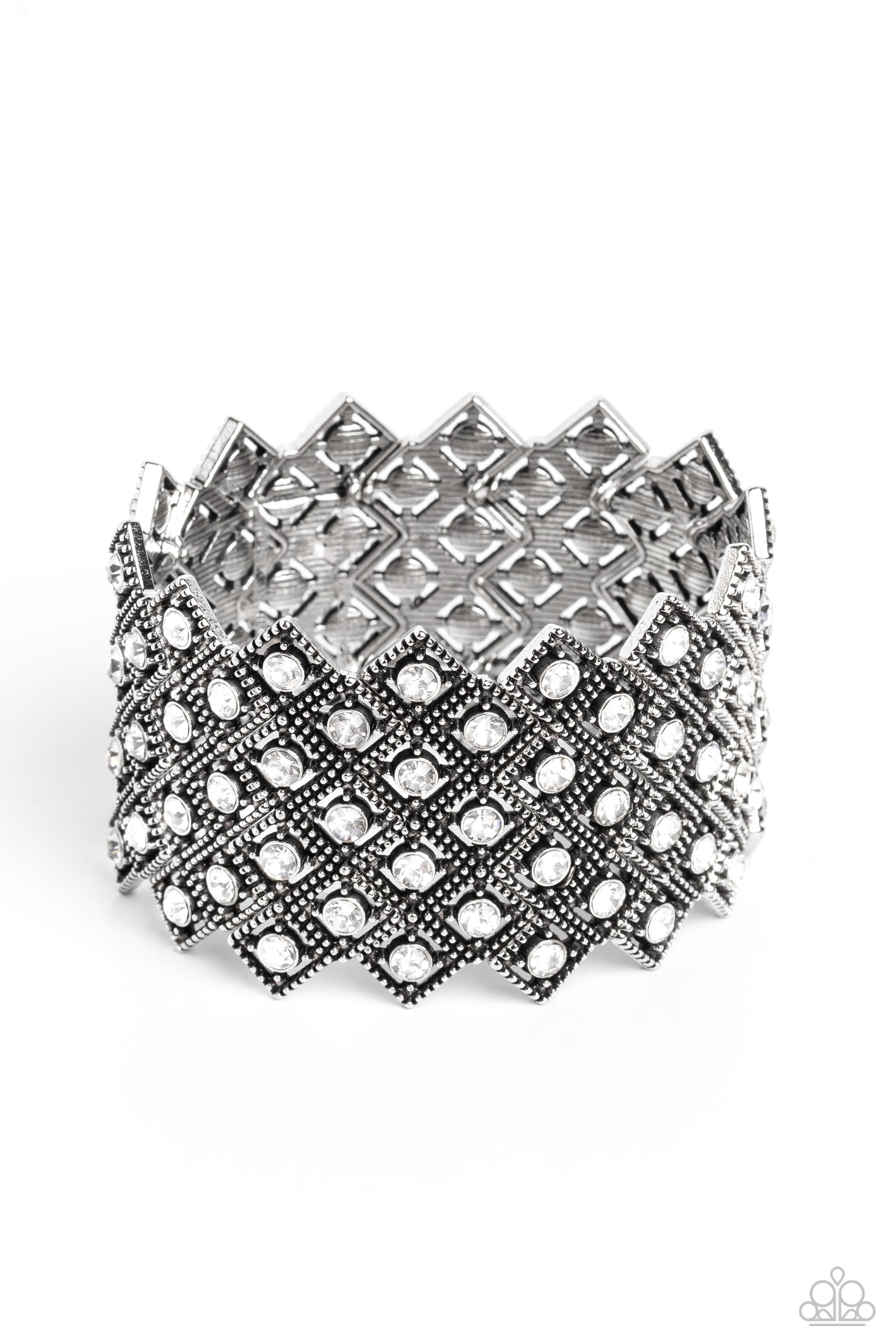 Paparazzi Accessories DECO in the Rough - White Glittery silver-studded diamond frames filled with white rhinestones cluster together in a geometric pattern around the wrist on elastic stretchy bands for a glitzy art deco finish. Sold as one individual br