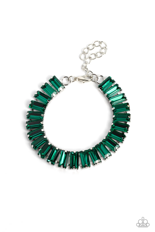 Paparazzi Accessories Darling Debutante - Green Set in prominent, pronged silver fittings, a glassy collection of emerald-cut, green gems fall in line around the wrist, creating a stunning, light-catching display. Features an adjustable clasp closure. Sol