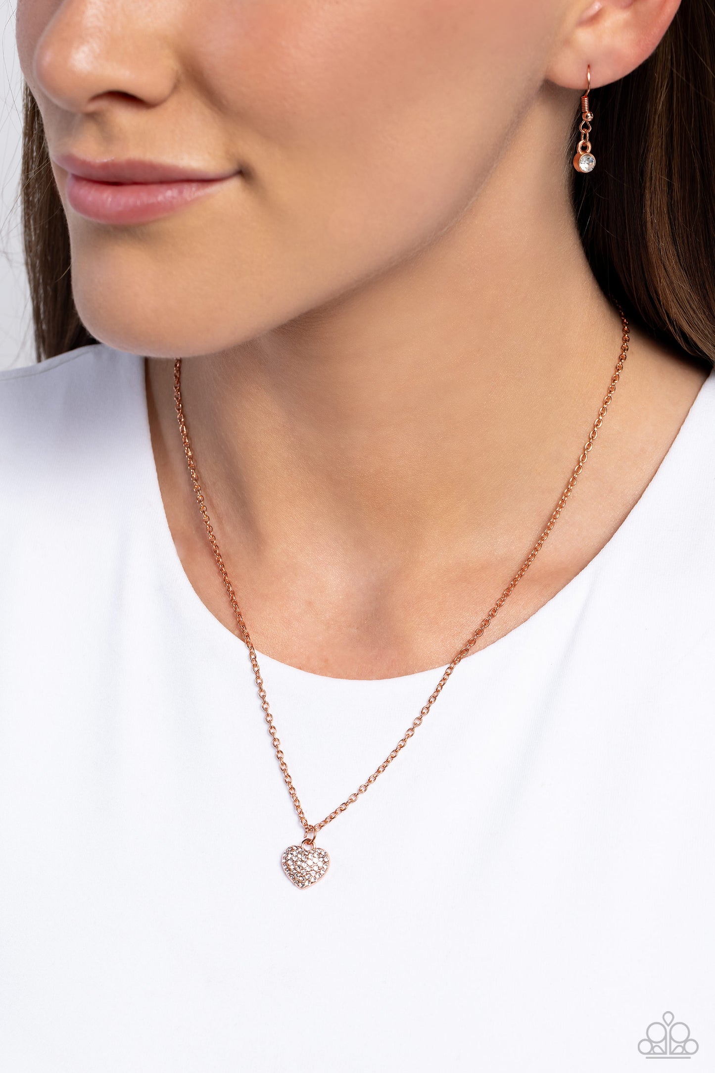 Paparazzi Accessories Goin Courtin - Copper Encrusted in white rhinestones, a shiny copper heart slides along a dainty shiny copper chain, creating a heartfelt pendant below the collar. Features an adjustable clasp closure. Sold as one individual necklace