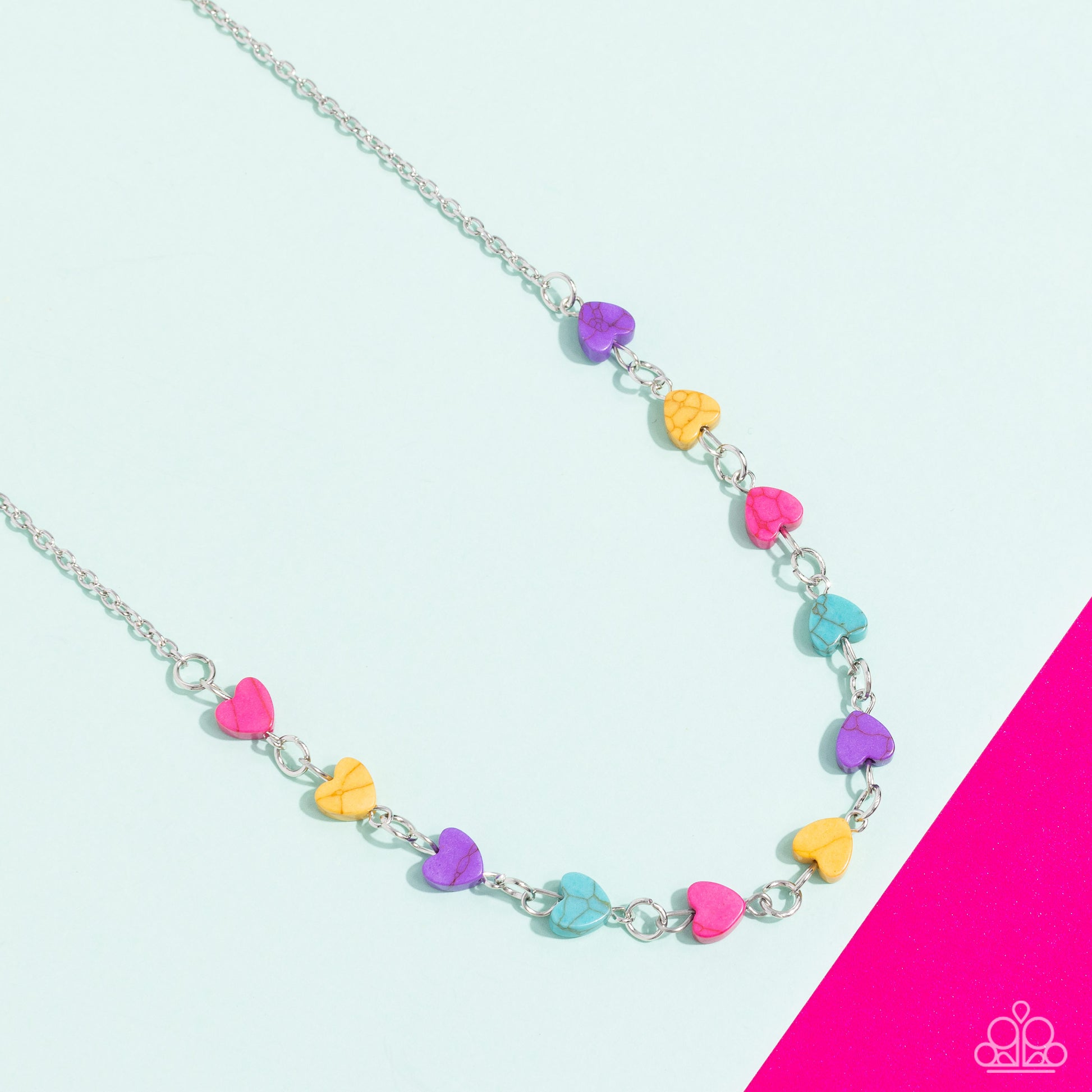 Paparazzi Accessories Wild at Heart - Pink Heart-shaped stones in shades of hot pink, yellow, purple and turquoise dances along a dainty, shimmery silver chain below the collar for a romantic finish. Features an adjustable clasp closure. As the stone elem
