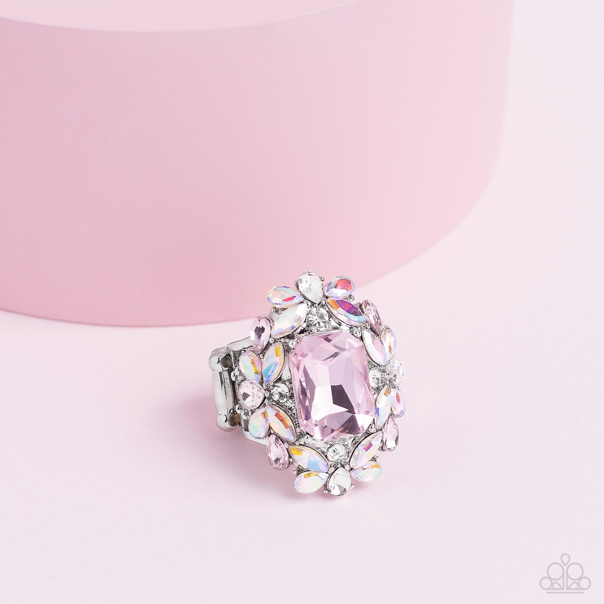 Paparazzi Accessories Dynamic Diadem - Pink A faceted radiant-cut pink gem is pressed into an elaborate frame filled with blinding round, teardrop and marquise-cut gems in shades of white, pink, and iridescent for a blingy statement atop the finger. Featu