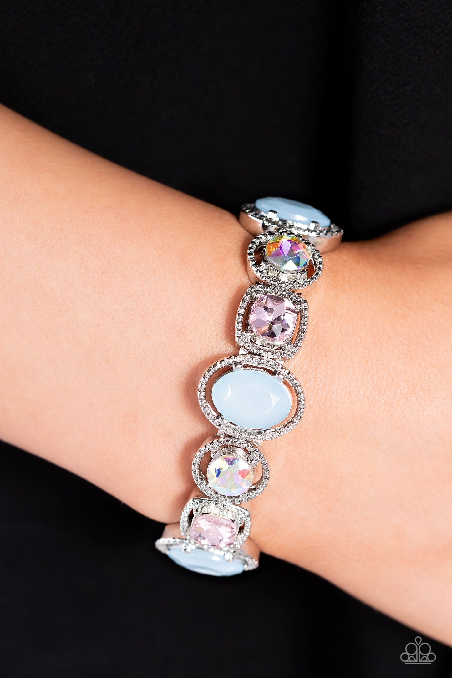 Paparazzi Accessories Fashion Fairy Tale - Multi Pressed in the center of pronged and studded thick silver oval, circular, and square frames, iridescent and light pink gems and milky blue beads alternate around the wrist on elastic stretchy bands for a re