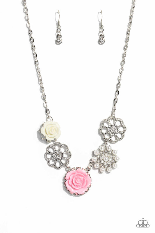 Paparazzi Accessories Tea Party Favors - Pink A collection of whimsical, refined flowers gathers along a flat, sleek silver link chain. The featured charms include an ivory resin rose blooming atop a glittery silver floral silhouette, two silver flowers d