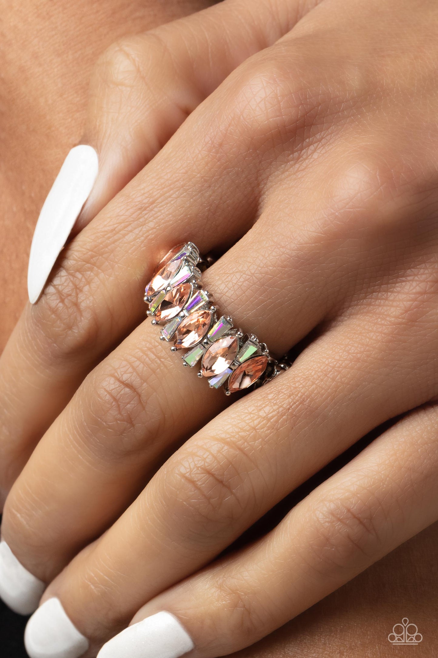Paparazzi Accessories Kaleidoscopic Knockout - Orange A row of glassy orange marquise-cut rhinestones, encased in dainty silver-pronged fittings, alternate with dainty silver-pronged iridescent rhinestone bars as they connect across the finger, creating a