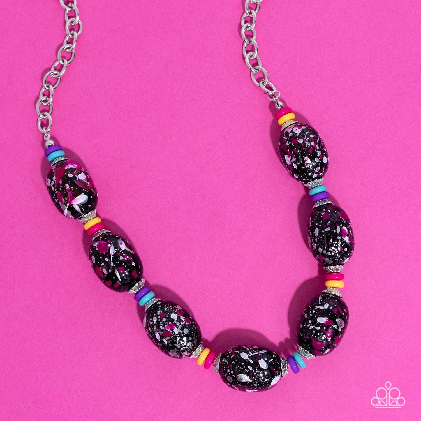 Paparazzi Accessories No Laughing SPLATTER - Pink Featuring a hot pink, white, and silver paint splatter, oversized black beads loop around the collar from a classic silver link chain. Silver floral fittings and small discs in shades of hot pink, yellow,