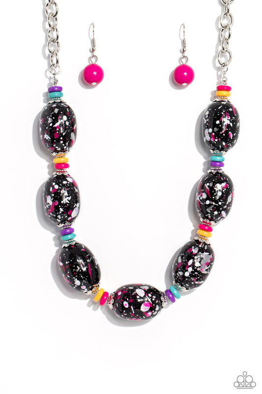 Paparazzi Accessories No Laughing SPLATTER - Pink Featuring a hot pink, white, and silver paint splatter, oversized black beads loop around the collar from a classic silver link chain. Silver floral fittings and small discs in shades of hot pink, yellow,