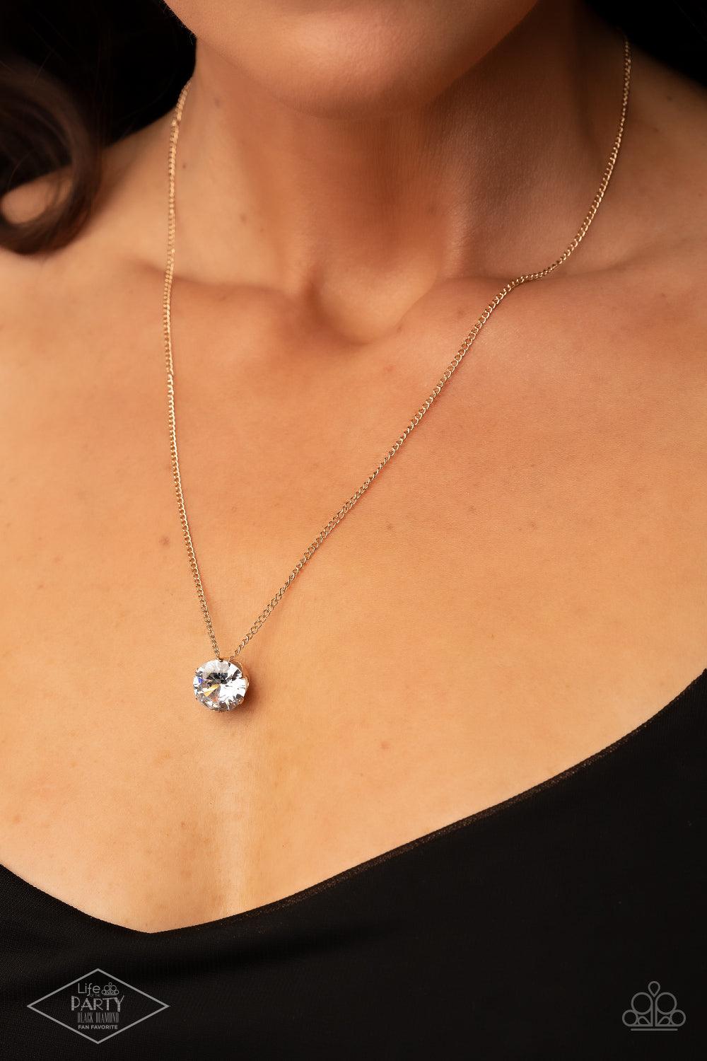 Paparazzi Accessories What A Gem - Gold A single rhinestone sparkles brilliantly at the bottom of a dainty gold chain, creating a stunning solitaire design. Features an adjustable clasp closure. Sold as one individual necklace. Includes one pair of matchi