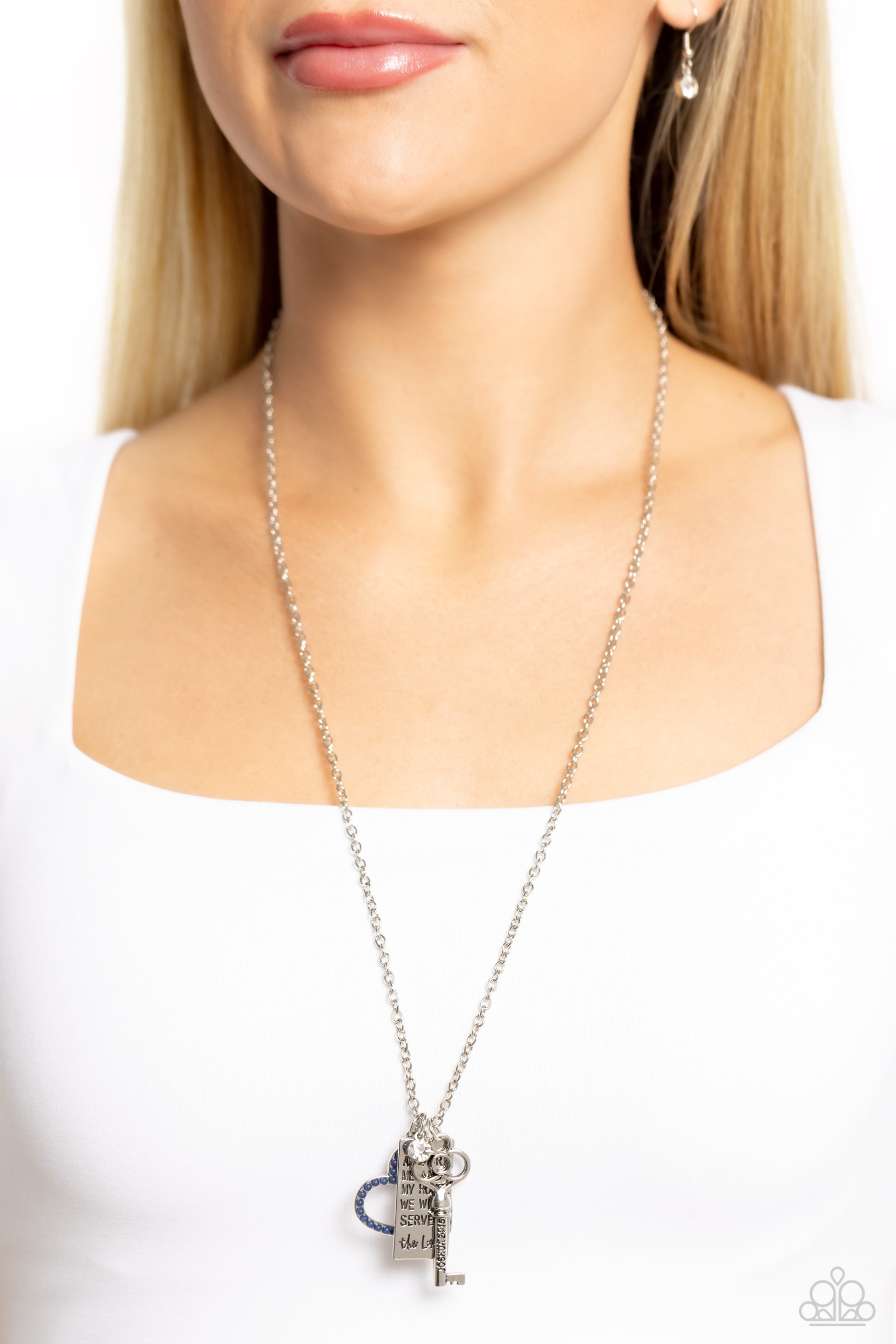 Paparazzi Accessories Indulgent Belief - Blue Dotted in dainty navy beads, an airy heart frame joins a silver rectangle stamped in the biblical passage, "As for me and my house we will serve the Lord," a dainty white gem, and an intricate silver key stamp