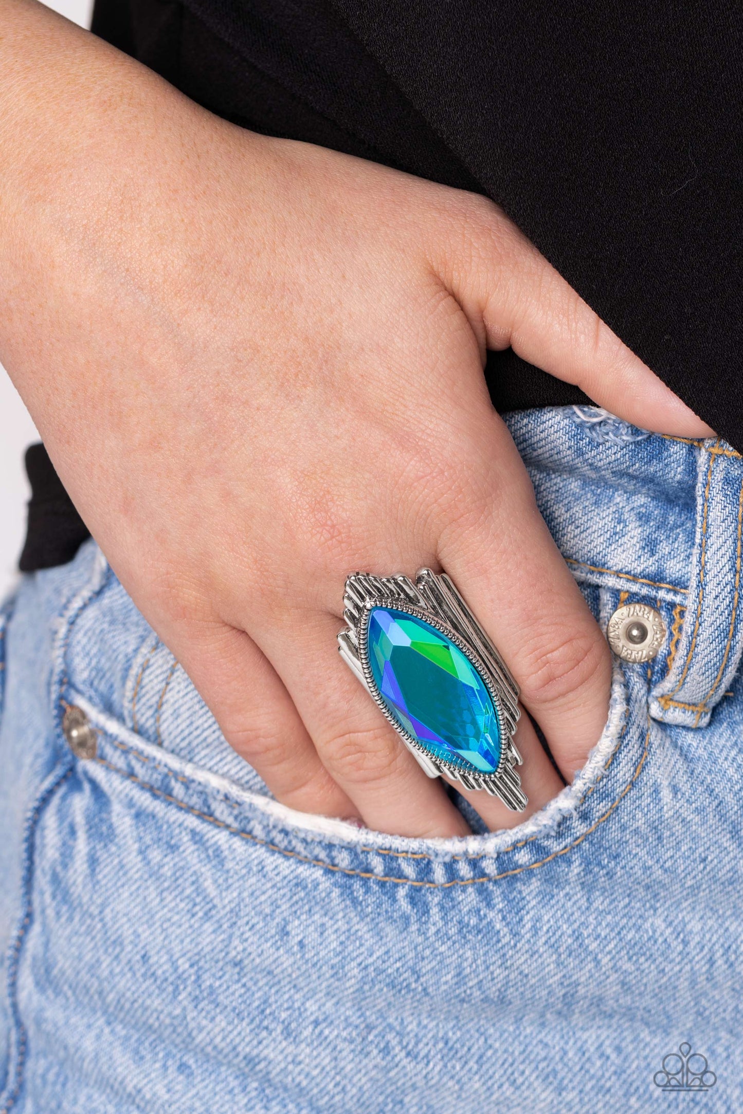 Paparazzi Accessories Stunning Showman - Green Wavy silver bars asymmetrically stack and elongate into an uneven band across the finger, resulting in an edgy fashion. Pressed in a studded silver frame and centered across the asymmetrical stack, an oversiz