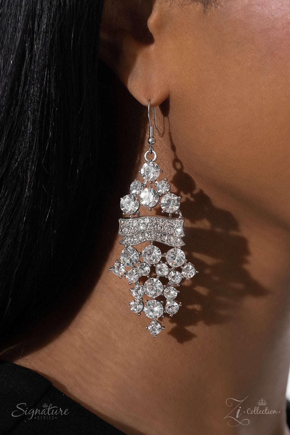 Paparazzi Accessories The DEtta Wavy silver bars, encrusted in white rhinestones, create a striking silhouette as they fall along the neckline. An explosion of sparkle erupts below the brilliant bands, with countless white rhinestones strategically stagge