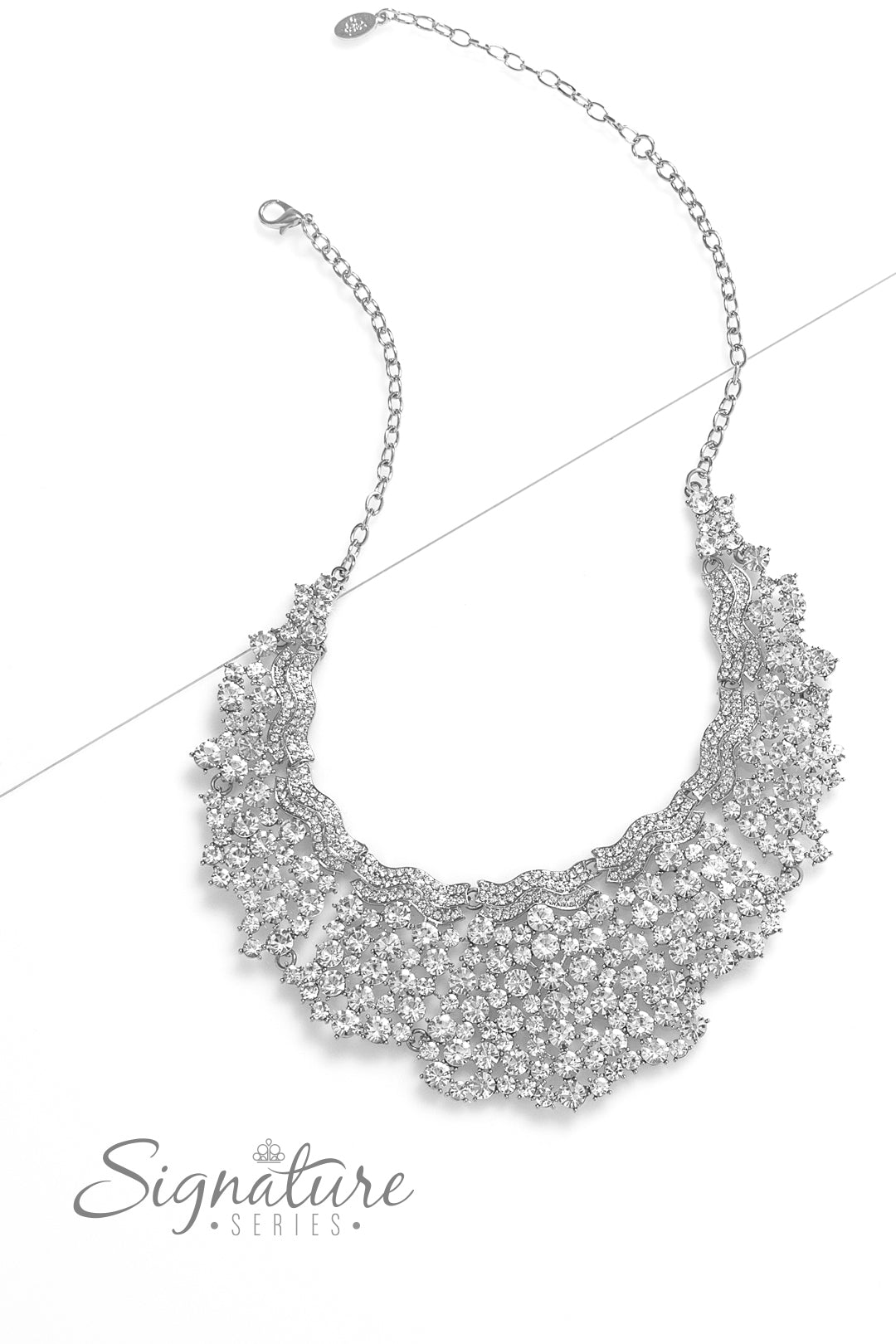 Paparazzi Accessories The DEtta Wavy silver bars, encrusted in white rhinestones, create a striking silhouette as they fall along the neckline. An explosion of sparkle erupts below the brilliant bands, with countless white rhinestones strategically stagge