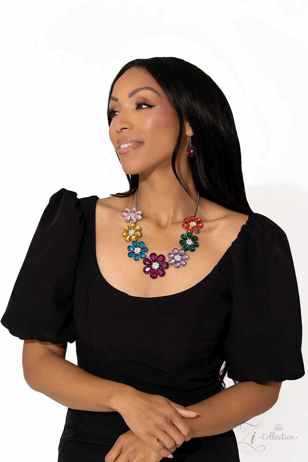 Paparazzi Accessories Outgoing - Multi Colorful teardrop-shaped petals fan out around clusters of corrugated sparkle, blossoming into an enchanted kaleidoscope. The faceted surfaces of each petal add texture and depth, allowing the floral frames to pop wi