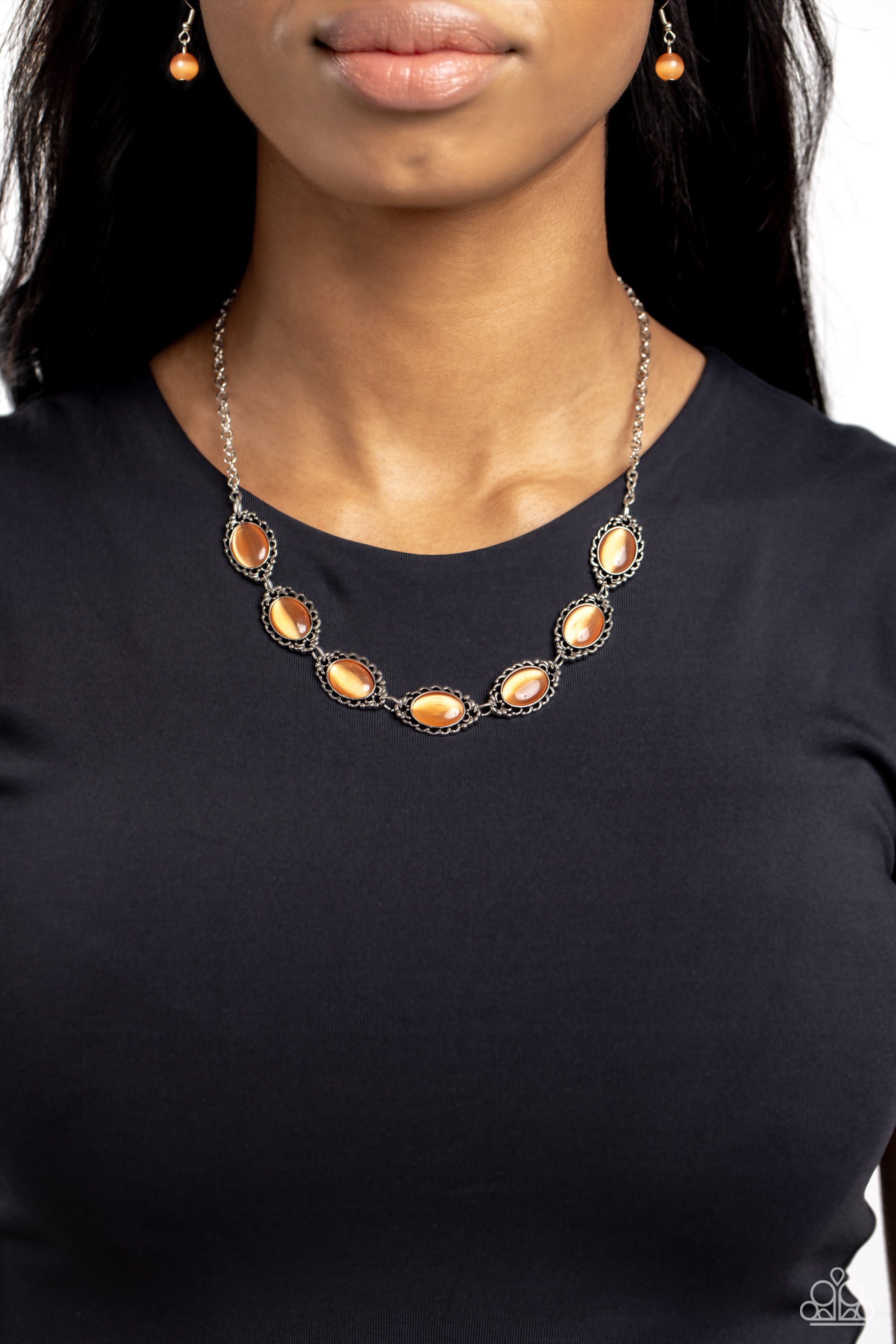 Paparazzi Accessories Framed in France - Orange Smooth orange cat's eye stones are pressed into shimmery, ornate silver frames, creating a natural and whimsical look below the collar. Features an adjustable clasp closure. Sold as one individual necklace.