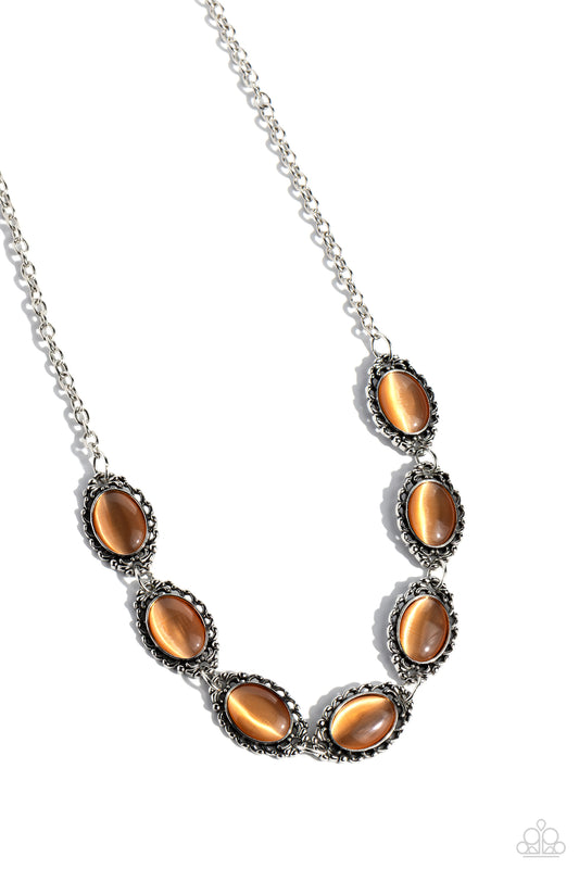 Paparazzi Accessories Framed in France - Orange Smooth orange cat's eye stones are pressed into shimmery, ornate silver frames, creating a natural and whimsical look below the collar. Features an adjustable clasp closure. Sold as one individual necklace.